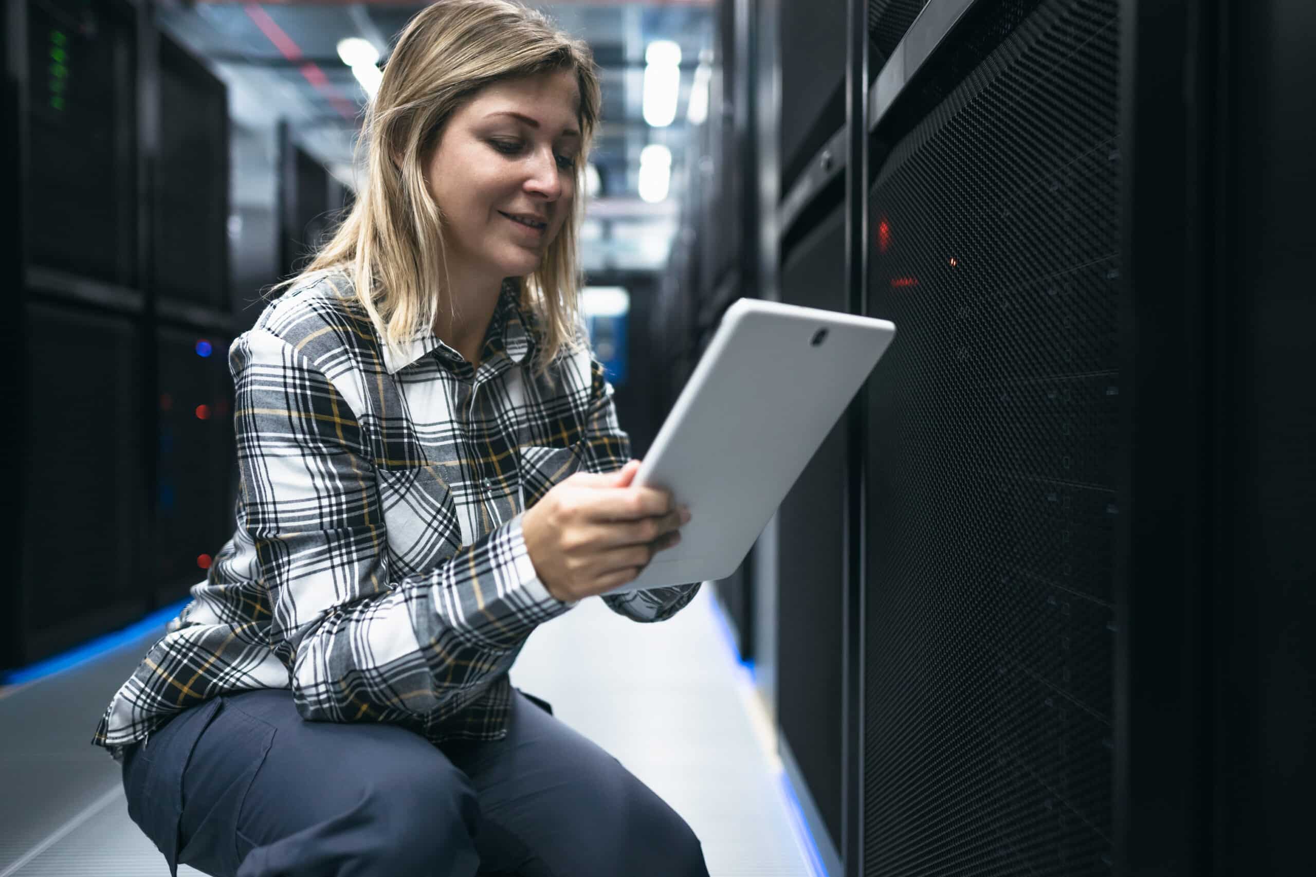 https://integrumtechnology.net/wp-content/uploads/2022/10/female-data-center-technician-working-inside-serve-2022-01-31-18-01-57-utc-1-scaled.jpg